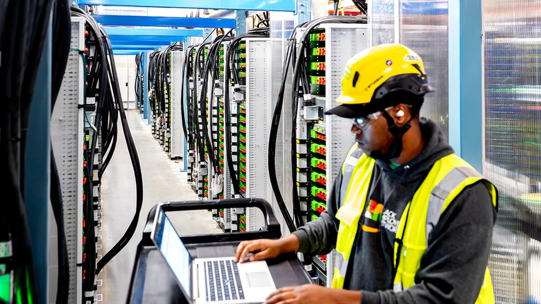A technician working at the racks inside the Markley facility